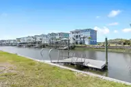 402 Dolphin Street, Sunset Beach, NC 28468 — 3-bedroom waterfront home, Sunset Beach, NC, photo 11 of 53: Private Floating Boat Dock