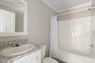 6777 Lewis Drive SE, Winnabow, NC 28479 — 3-bedroom manufactured home in Lewis Acres, Winnabow, NC, photo 20 of 22: Guest bathroom