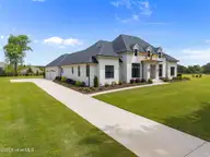 47 E Rolling Meadows Road, Hampstead, NC 28443 — 4-bedroom home in Whitebridge, Hampstead, NC, photo 1 of 72: 13-web-or-mls-DJI_20260413125046_0679_D