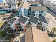 1412 Canal Drive Apt C, Carolina Beach, NC 28428 — 2-bedroom waterfront condo, Carolina Beach, NC, photo 3 of 41: 55-web-or-mls-DJI_20250311165149_0558_D
