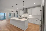 3804 Emerald Drive E, Emerald Isle, NC 28594 — 4-bedroom waterfront townhome in Emerald Isle By The Sea, Emerald Isle, NC, photo 13 of 46: Kitchen Open to Living Room