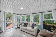 721 Blue Sail Drive SE, Bolivia, NC 28422 — 2-bedroom manufactured home in River Run Plantation, Bolivia, NC, photo 10 of 59: 31_sun room
