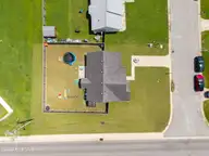143 Sutton Drive, Elizabeth City, NC 27909 — 3-bedroom home in Carolina Village, Elizabeth City, NC, photo 16 of 18: 143 Sutton Drive Drone 3