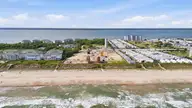 105 Ocean Promenade, Indian Beach, NC 28512 — 5-bedroom waterfront home in The Pearls Oceanside, Indian Beach, NC, photo 9 of 17: 6-print-DJI_20260505163033_0835_D