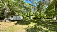 648 Old Church Road, Swansboro, NC 28584 — 3-bedroom manufactured home in Cedar Creek Est, Swansboro, NC, photo 11 of 37: backyard