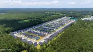 230 Ladyfish Loop NW, Sunset Beach, NC 28468 — 3-bedroom home in Sunfish Cove, Sunset Beach, NC, photo 18 of 19: DJI_20250611122621_0009_D