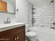 3215 Herthwood Place SW, Supply, NC 28462 — 3-bedroom waterfront manufactured home in West Tanglewood, Supply, NC, photo 15 of 36: guest bathroom
