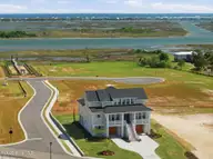 26 Solstice Way, Hampstead, NC 28443 — 4-bedroom waterfront home in East Wynd, Hampstead, NC, photo 6 of 55: View of Home and waterway