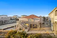 4025 E Beach Drive, Oak Island, NC 28465 — 3-bedroom waterfront home in Long Beach, Oak Island, NC, photo 4 of 40: 4-web-or-mls-CAMMediaLLC.com (4 of 47)