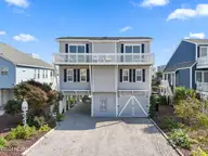415 Sailfish Street, Sunset Beach, NC 28468 — 4-bedroom waterfront home in Sunset Beach, Sunset Beach, NC, photo 1 of 63: 415 Sailfish