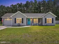 102 Blossom Court, Maple Hill, NC 28454 — 3-bedroom home in The Villas at Jackson Court, Maple Hill, NC, photo 1 of 26: 102 Blossom Twilight Image