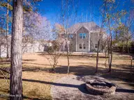 211 Cheswick Drive, Holly Ridge, NC 28445 — 3-bedroom home in The Preserve At Morris Landing, Holly Ridge, NC, photo 6 of 65: Brick fire pit
