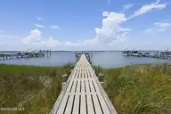 8632 Sound Drive A1, Emerald Isle, NC 28594 — 2-bedroom waterfront condo in Sunset Harbor, Emerald Isle, NC, photo 3 of 52: Private Day Dock - Building 2