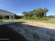 442 Hinton Lane SW 115, Ocean Isle Beach, NC 28469 — 4-bedroom home in Glendale Arbor, Ocean Isle Beach, NC, photo 2 of 26: Lot 115 Back