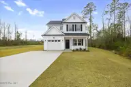 60 Gordy Way, Hampstead, NC 28443 — 4-bedroom home in Harrison Cove, Hampstead, NC, photo 2 of 23: 20-FinalExteriorHampstead-2