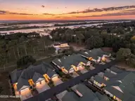 507 Sunset Oaks Lane, Sunset Beach, NC 28468 — 3-bedroom townhome in Sunset Oaks Garden Homes, Sunset Beach, NC, photo 20 of 22: 2_virtual twilight aerial