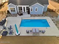 411 Summerhouse Drive, Holly Ridge, NC 28445 — 4-bedroom waterfront home in Summerhouse On Everett Bay, Holly Ridge, NC, photo 13 of 73: DJI_20260216165354_0757_D