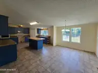 307 Kimberly Court, Elizabeth City, NC 27909 — 4-bedroom manufactured home in Horseshoe Acres, Elizabeth City, NC, photo 8 of 20: Kitchen with Dining
