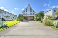 6707 Kings Lynn Drive, Oak Island, NC 28465 — 3-bedroom waterfront home in Kings Lynn, Oak Island, NC, photo 1 of 51: Final 6707 Kings Lynn Dr OKI-RJREM-4341