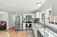 166 NE 5th Street, Oak Island, NC 28465 — 3-bedroom home in Tranquil Harbor, Oak Island, NC, photo 17 of 59: 16_kitchen