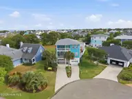 817 Ketch Court, Kure Beach, NC 28449 — 4-bedroom home in Kure Beach Village, Kure Beach, NC, photo 2 of 56: 4-web-or-mls-dji_20260430170610_0661_d