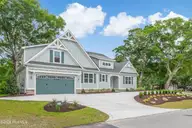 394 Sea Trail Drive W, Sunset Beach, NC 28468 — 4-bedroom home in Sea Trail Plantation, Sunset Beach, NC, photo 3 of 76: Front Elevation -Circular Drive