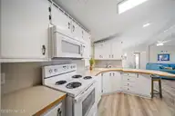 9105 W 9th Street, Surf City, NC 28445 — 3-bedroom waterfront manufactured home in Old Settlers Beach, Surf City, NC, photo 16 of 60: kitchenGI - 9105 9th St - Listing -25