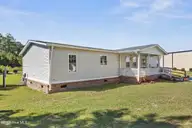 195 Calabash Road NW, Calabash, NC 28467 — 3-bedroom manufactured home in Carolina Shores, Calabash, NC, photo 2 of 37: Front Exterior