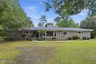 406 Country Club Drive, Jacksonville, NC 28546 — 3-bedroom home in Country Club Acres, Jacksonville, NC, photo 1 of 56
