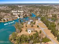119 Waters Edge Drive, Hampstead, NC 28443 — 4-bedroom waterfront home in Deerfield, Hampstead, NC, photo 7 of 28: 119_waters_edge_drive_boat_slip_598