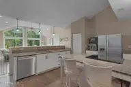 3405 Old Gate Road, Morehead City, NC 28557 — 3-bedroom home in Mandy Farms, Morehead City, NC, photo 5 of 40: Kitchen that opens to sunroom