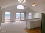 2105 S Shore Drive, Surf City, NC 28445 — 3-bedroom waterfront home in Grady Moore Beach, Surf City, NC, photo 2 of 2: Living Room Kitchen