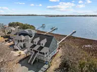 1039 Chadwick Shores Drive, Sneads Ferry, NC 28460 — 3-bedroom waterfront home in Chadwick Shores, Sneads Ferry, NC, photo 1 of 59: DJI_20260301115814_0121_D