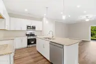 228 Cline Way Unit 131, Beaufort, NC 28516 — 3-bedroom townhome in 1809 Live Oak, Beaufort, NC, photo 7 of 37: Kitchen Open to Living Room