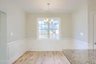 202 Broadleaf Drive, Jacksonville, NC 28546 — 4-bedroom waterfront home in Creekside at Aragona Village, Jacksonville, NC, photo 15 of 34: Dining room