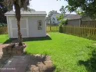 4111 Yarmouth Road, New Bern, NC 28562 — 3-bedroom home in Kings Row, New Bern, NC, photo 9 of 25: Powered Shed