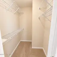 3917 Sterling Pointe Drive Kk4, Winterville, NC 28590 — 3-bedroom townhome in Sterling Pointe, Winterville, NC, photo 14 of 19: primary closet