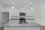 496 Getaway Lane 116, Shallotte, NC 28470 — 3-bedroom home in Summers Walk, Shallotte, NC, photo 17 of 36: 20_kitchen