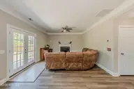 673 Morris Landing Road, Holly Ridge, NC 28445 — 3-bedroom home in The Preserve At Morris Landing, Holly Ridge, NC, photo 10 of 76: Living room