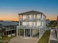1012 W Beach Drive, Oak Island, NC 28465 — 5-bedroom waterfront home in Long Beach, Oak Island, NC, photo 2 of 70: 2-web-or-mls-CAMMediaLLC.com (1 of 1)