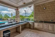 8815 10 Carenden Court, Sunset Beach, NC 28468 — waterfront lot in Thistle Downs, Sunset Beach, NC, photo 19 of 22: Thistle Pool area Kitchen