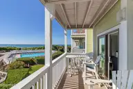 9201 Coast Guard Road A208, Emerald Isle, NC 28594 — 3-bedroom waterfront condo in Pebble Beach, Emerald Isle, NC, photo 7 of 45: Covered porch overlooking pool and ocean