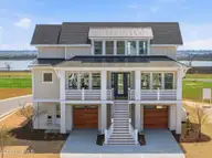 26 Solstice Way, Hampstead, NC 28443 — 4-bedroom waterfront home in East Wynd, Hampstead, NC, photo 3 of 55: Front Exterior