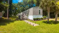7249 Lula Street SW, Ocean Isle Beach, NC 28469 — 3-bedroom manufactured home, Ocean Isle Beach, NC, photo 1 of 49: Front of Home