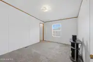 124 Zack Circle, Elizabeth City, NC 27909 — 3-bedroom manufactured home in Red Oak, Elizabeth City, NC, photo 22 of 36: Bedroom 2