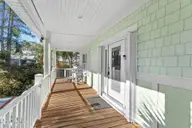 1404 W Yacht Drive, Oak Island, NC 28465 — 3-bedroom waterfront home in Pinners Point, Oak Island, NC, photo 3 of 46: front porch