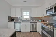 4005 E Beach Drive, Oak Island, NC 28465 — 7-bedroom waterfront home in E. Long Beach, Oak Island, NC, photo 11 of 65: Affinity 11