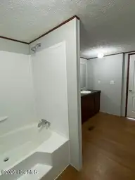 1951 Stanley Road SW, Supply, NC 28462 — 4-bedroom manufactured home, Supply, NC, photo 14 of 27: Mstr Bath 2