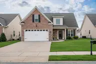 921 Dearborn Court, Winterville, NC 28590 — 3-bedroom home in Brighton Place, Winterville, NC, photo 5 of 42: Suburban home with lush lawn