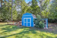 1003 Humphrey Road, Jacksonville, NC 28540 — 4-bedroom home in Georges Corner, Jacksonville, NC, photo 24 of 28: 1003 Humphrey Road shed